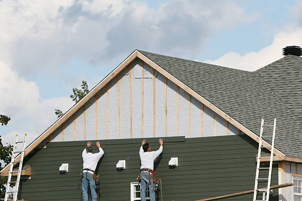 Professional Storm Damage Siding Repair technician working in Jackson, TN